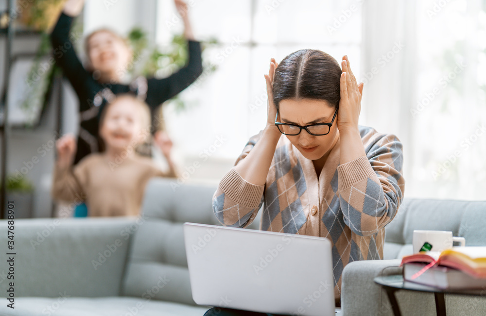 woman working on a laptop at home.