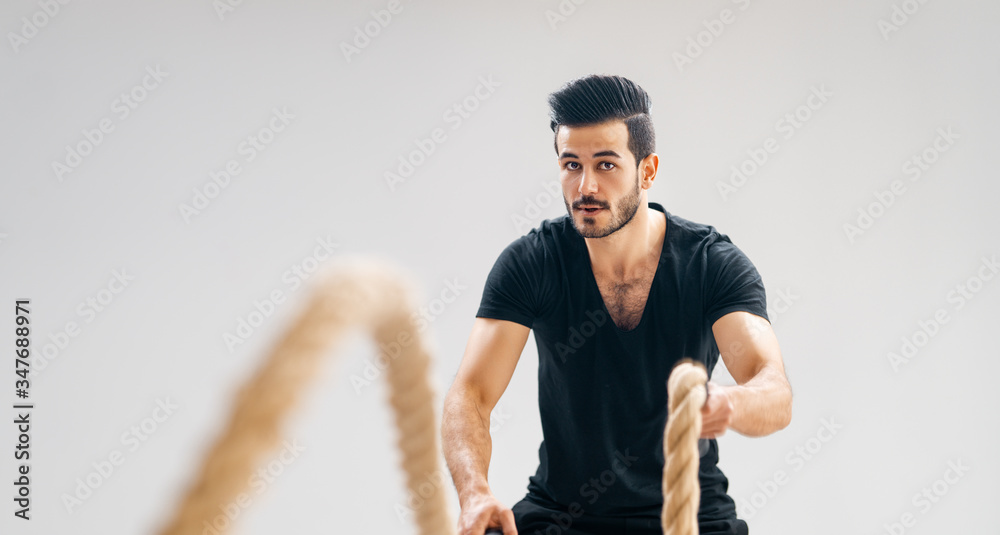 young man doing crossfit exercises