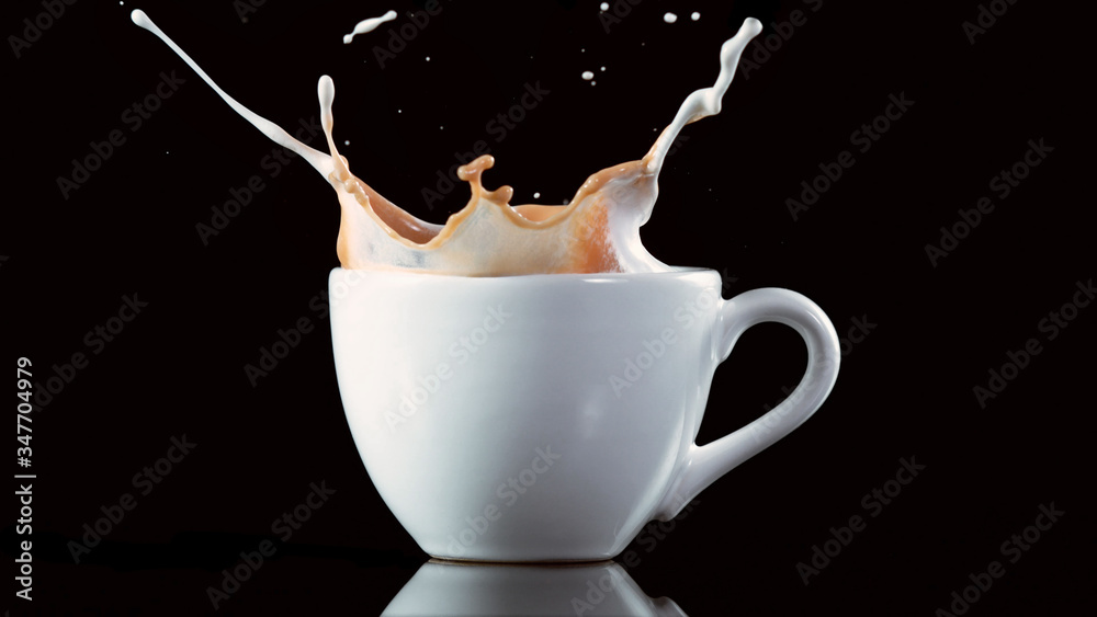 A cup with a large splash of coffee.