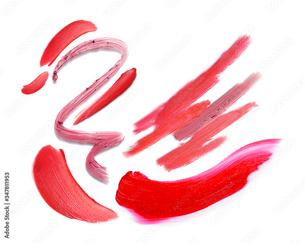 Samples of bright lipsticks on white background