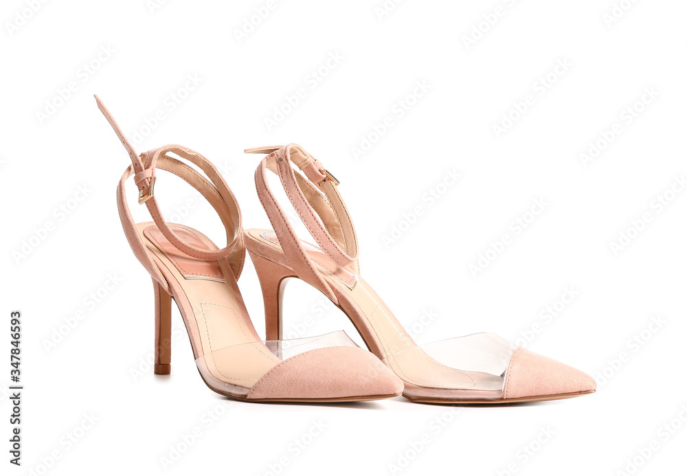 Modern high-heeled shoes on white background