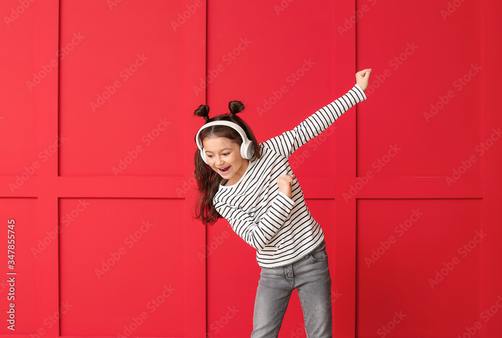 Cute dancing girl on color background