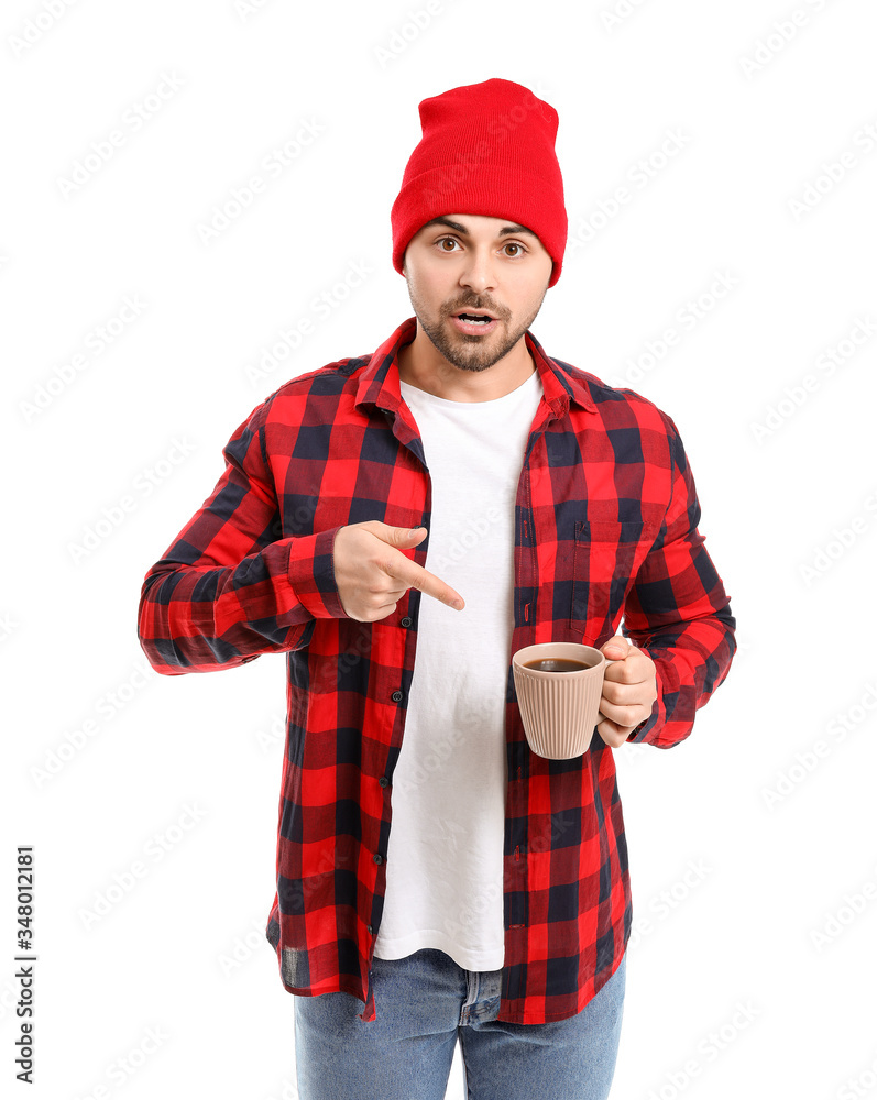 Surprised man with cup of hot coffee on white background