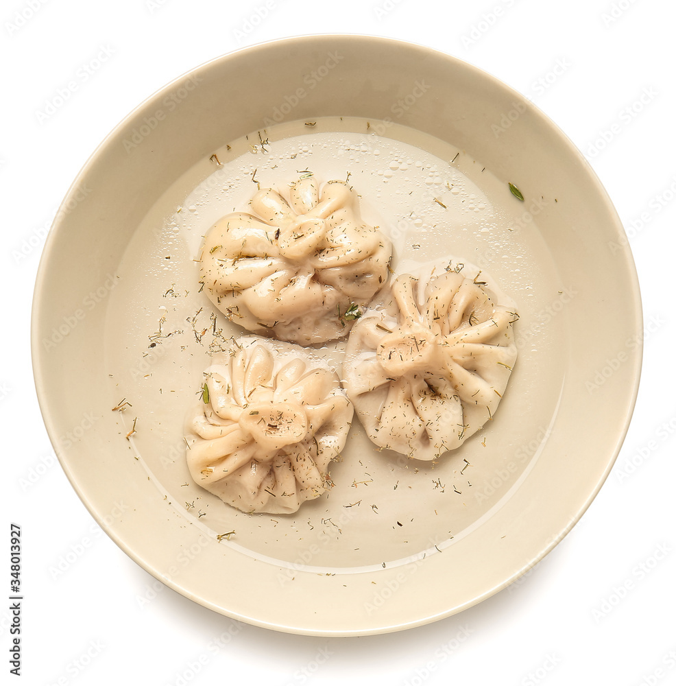 Plate with tasty dumplings on white background