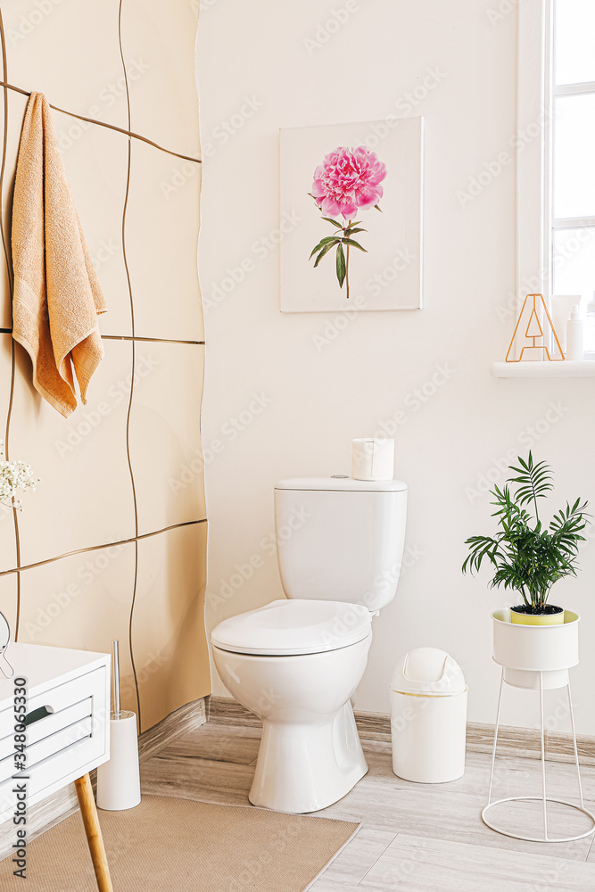 Interior of bathroom with floral decor