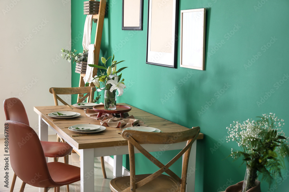 Interior of modern stylish dining room with floral decor