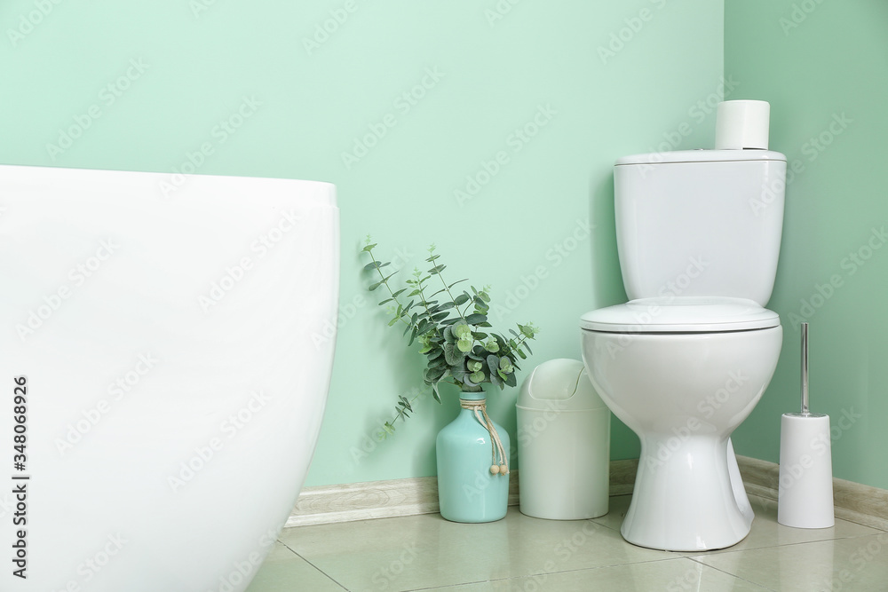 Interior of modern bathroom with floral decor