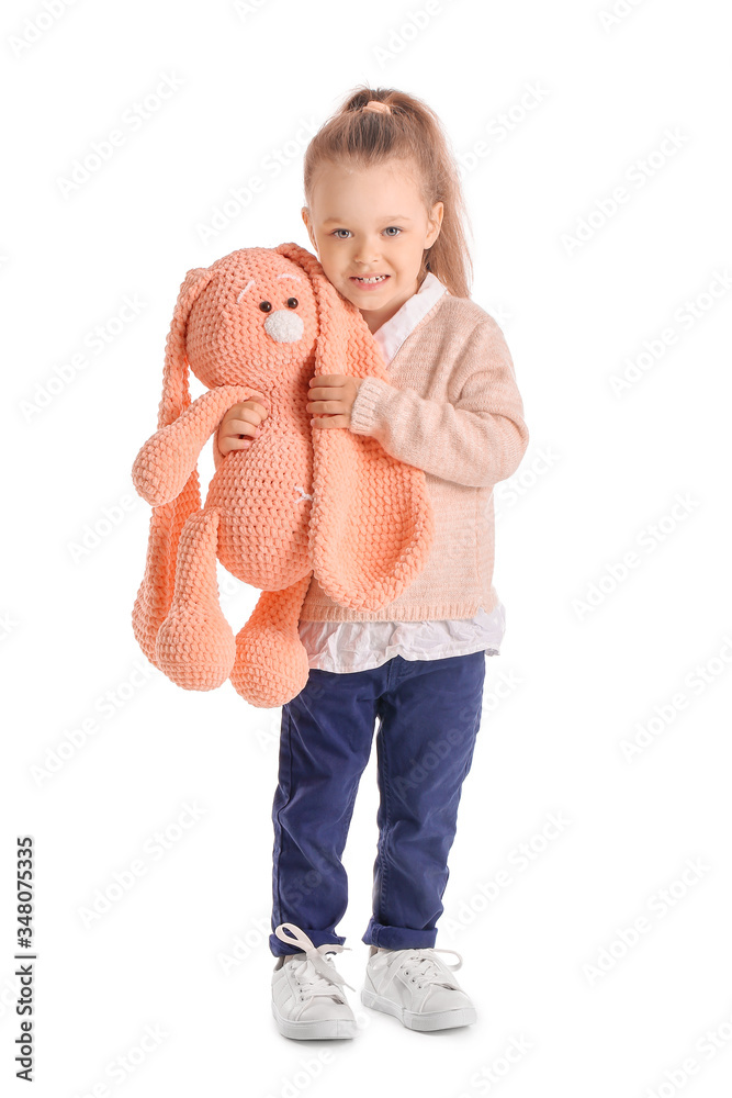 Little girl with toy on white background