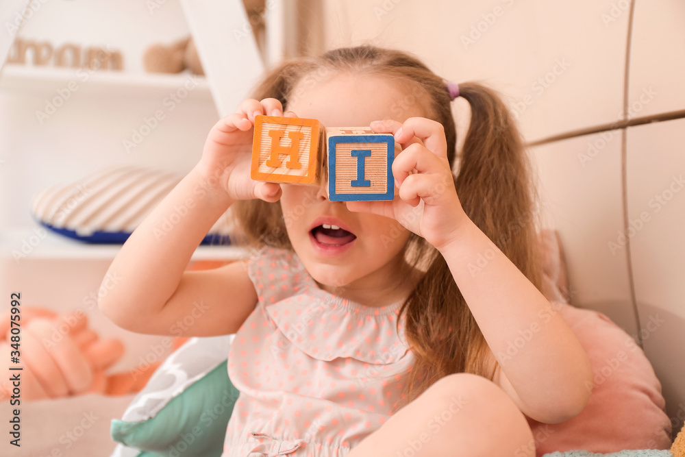 Little girl playing at home