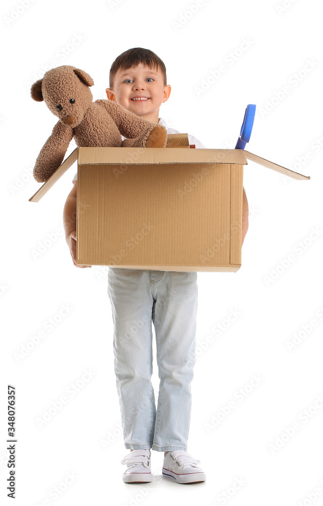 Little boy with toys on white background