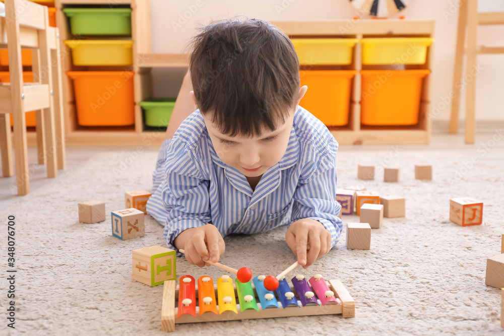 Little boy playing at home