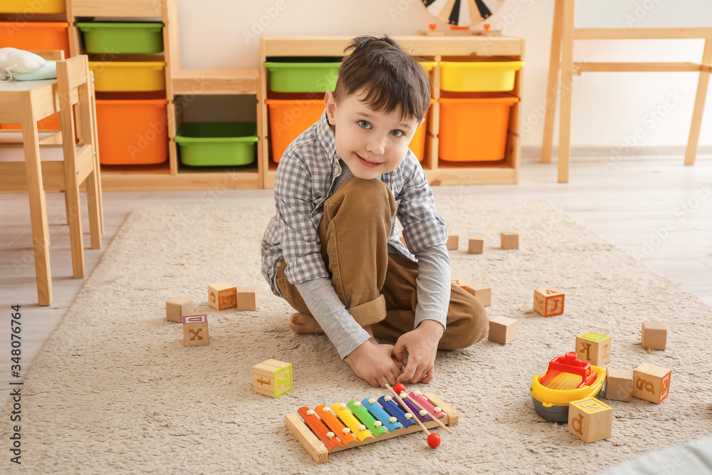 Little boy playing at home