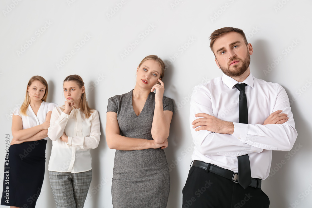 Business people waiting in line indoors