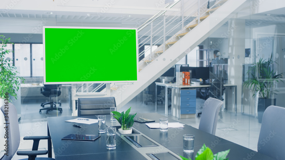 In the Corporate Office Meeting Room Stands Green Mock-up Screen TV or Interactive Digital Whiteboar