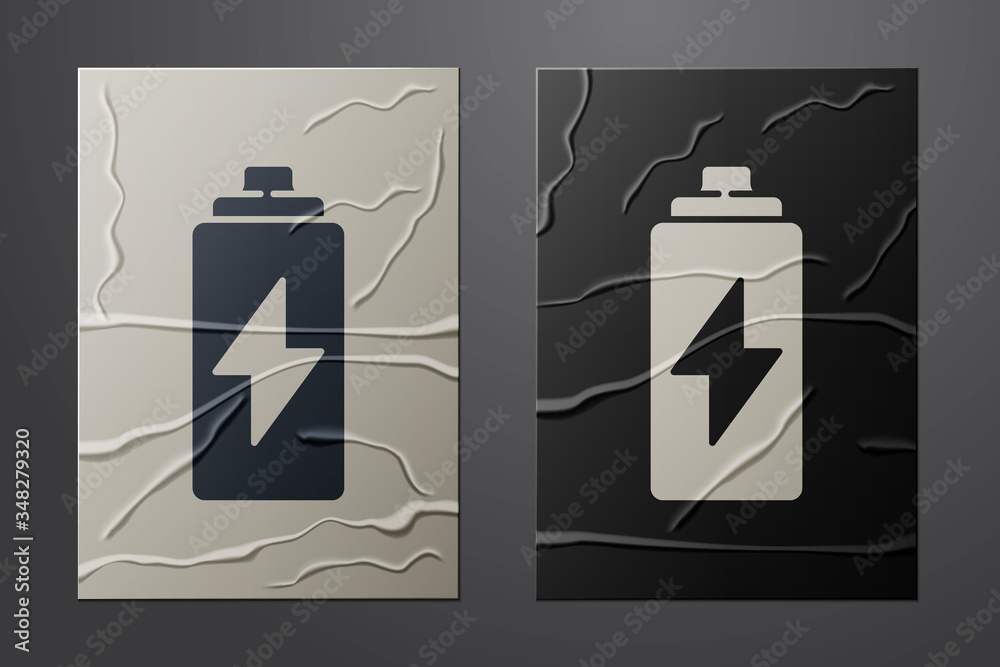 White Battery icon isolated on crumpled paper background. Lightning bolt symbol. Paper art style. Ve