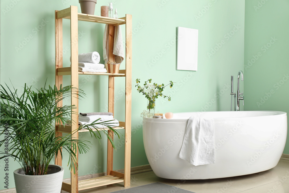 Interior of modern bathroom with floral decor