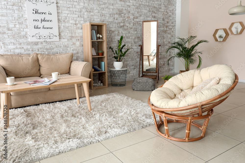 Comfortable armchair in interior of living room