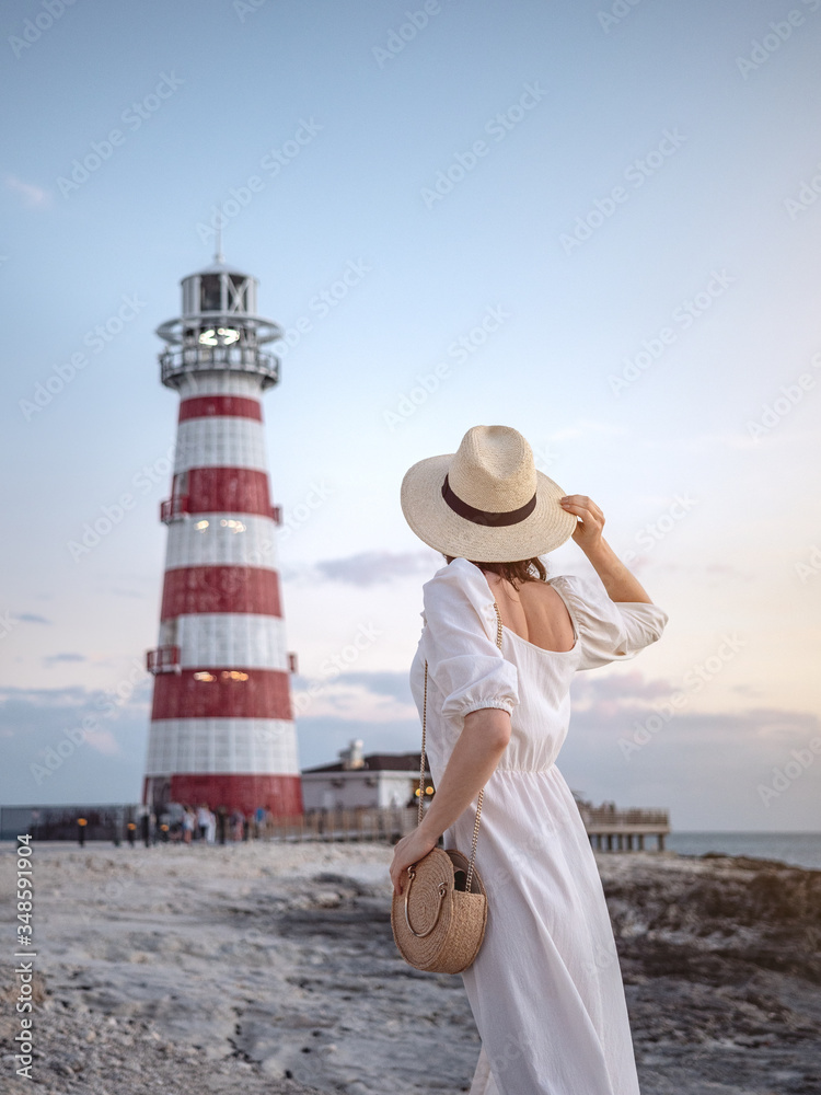 Young woman in a white dress outdoors