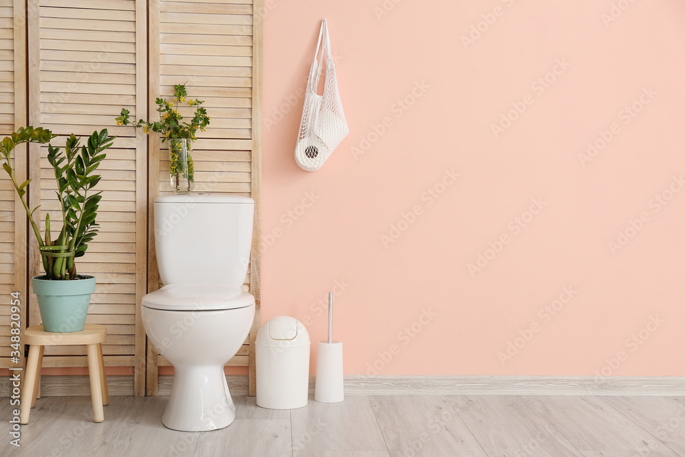 Interior of bathroom with floral decor