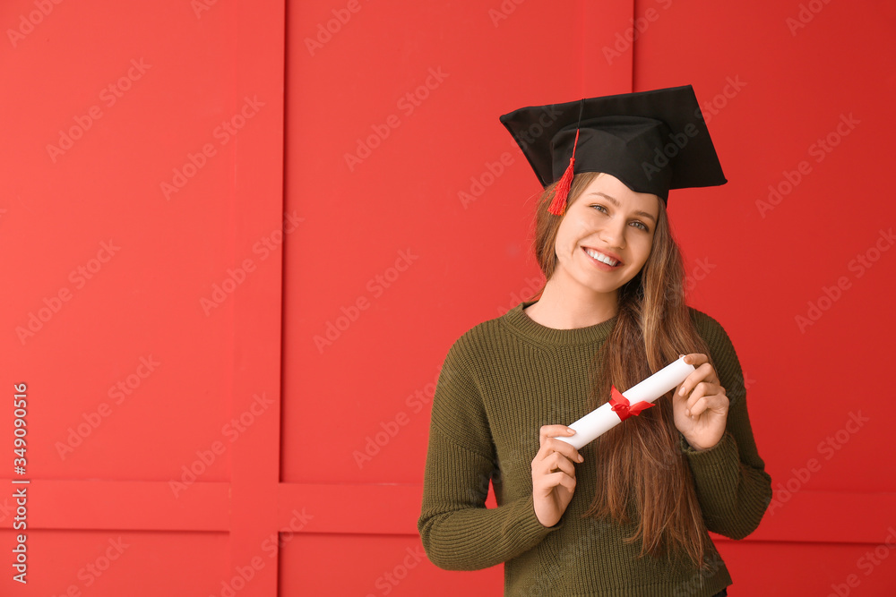 Female graduating student with diploma on color background