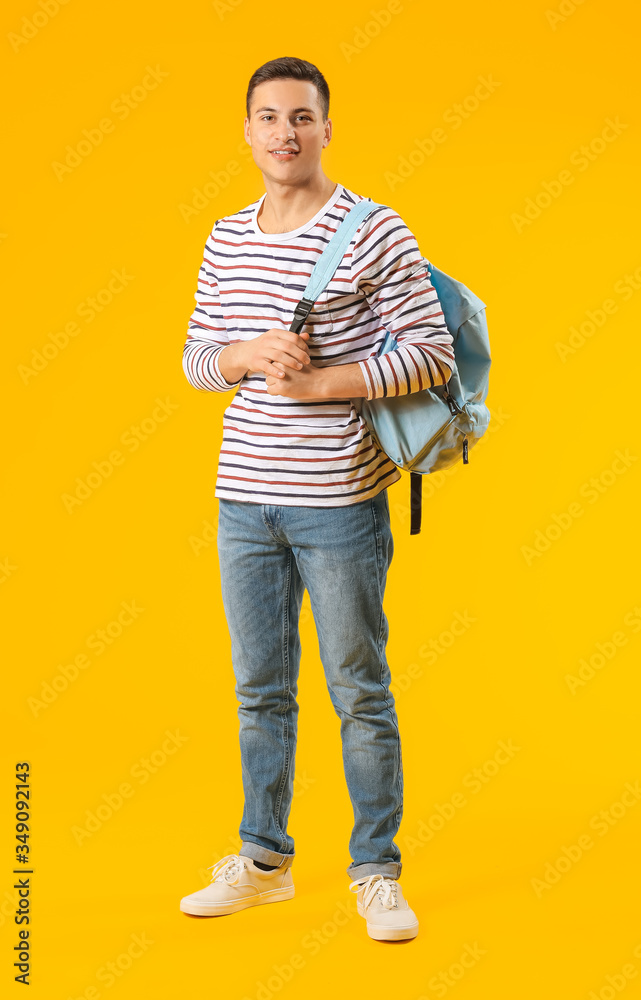 Portrait of male student on color background