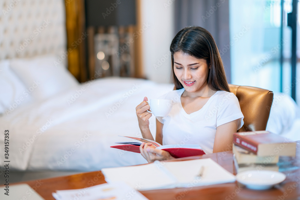 Asian student do a home work in her bed room