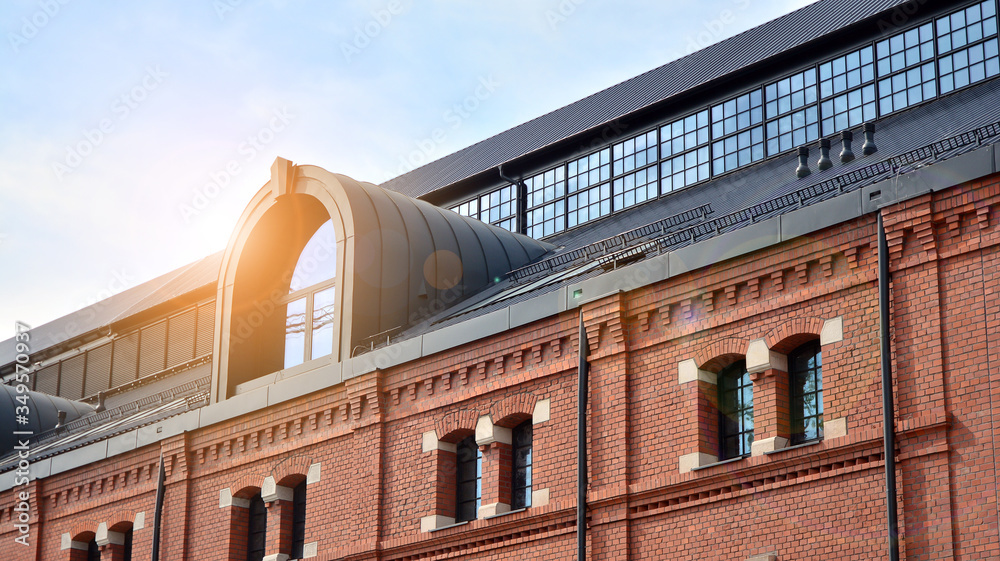 Revitalized red brick building and modern office building.