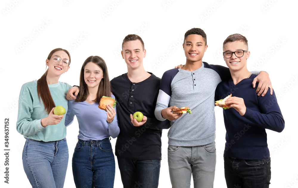 Pupils with tasty lunch on white background