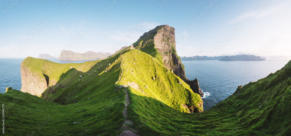 Panorama of green faroese hills and Kallur lighthouse on Kalsoy island, Faroe islands, Denmark. Land