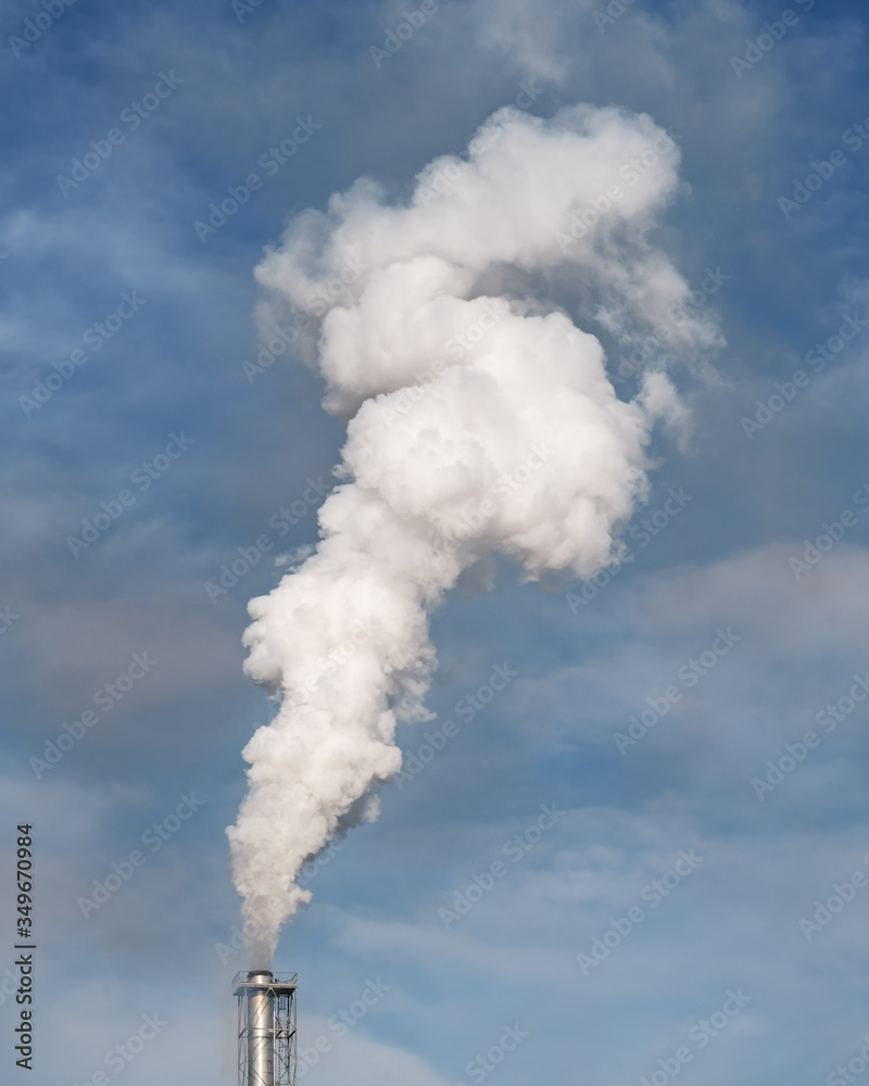 Smoke coming from the chimneys of the plant factory. Air pollution concept