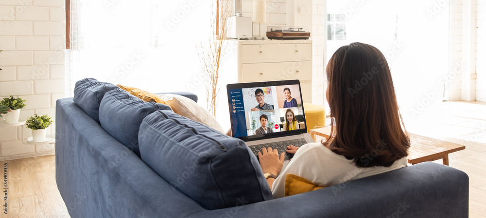 Young Asian businesswoman work at home and virtual video conference meeting with colleagues business