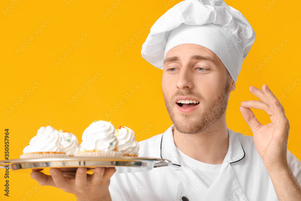 Male confectioner with tasty dessert on color background