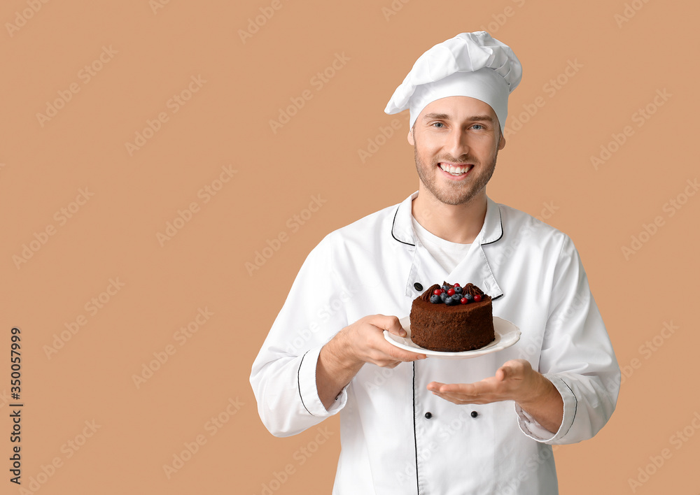 Male confectioner with tasty dessert on color background