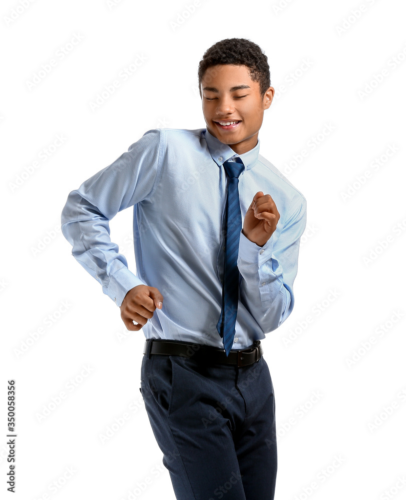 African-American teenager dancing against white background