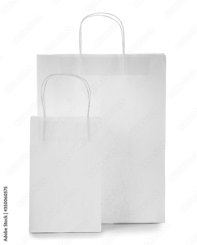 Paper shopping bags on white background