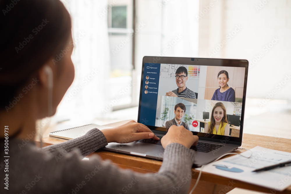 Young Asian businesswoman work at home and virtual video conference meeting with colleagues business