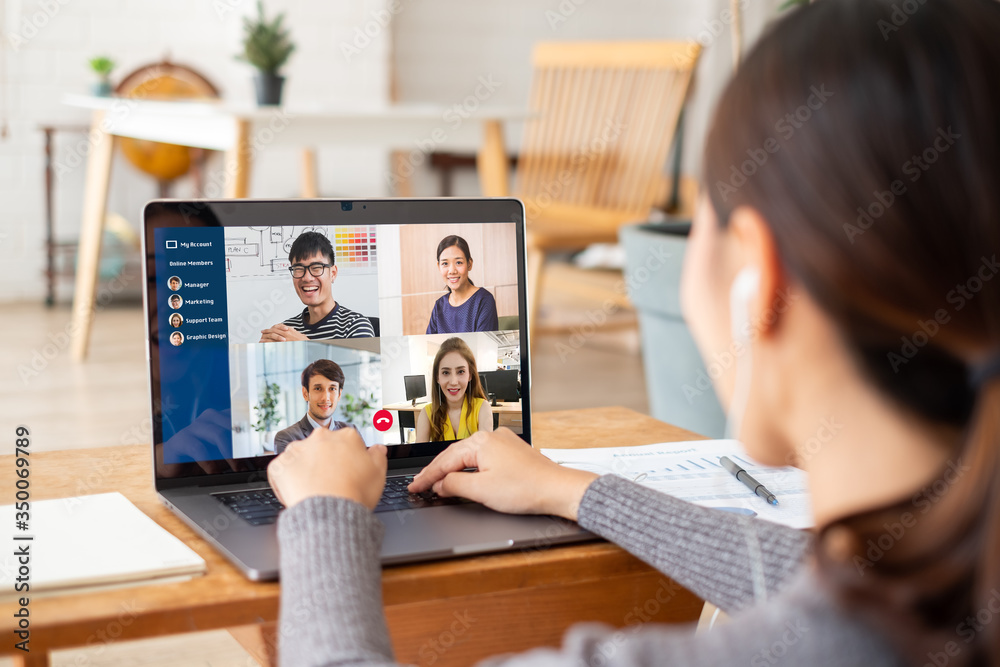 Young Asian businesswoman work at home and virtual video conference meeting with colleagues business