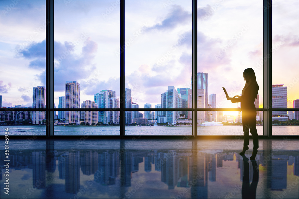 Young businesswoman in modern interior