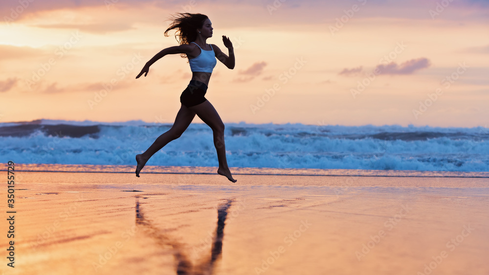 Barefoot young girl with slim body running along sea surf by water pool to keep fit and burning fat.