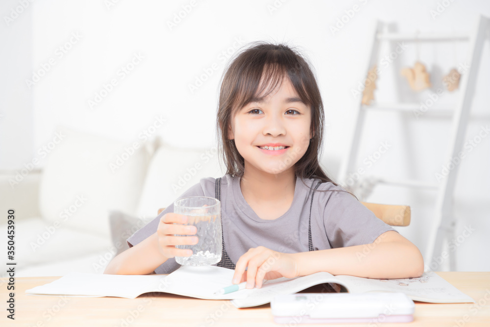 Asian little girl doing homework