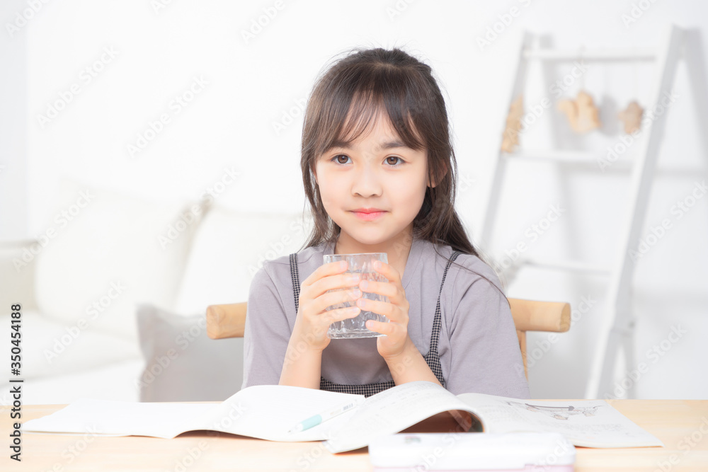 Asian little girl doing homework