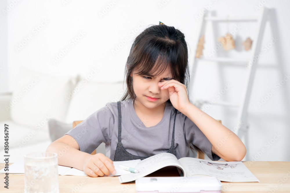 Asian little girl doing homework