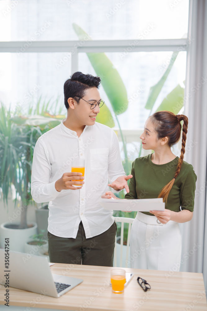 two young colleagues working in an office