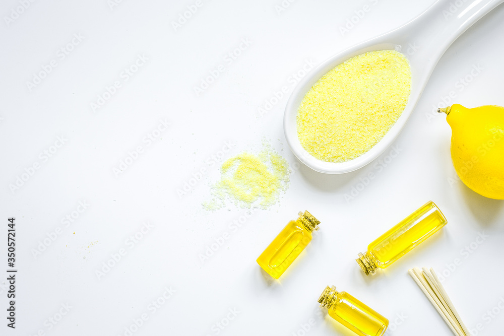 Cosmetic set with seasalt, oils and lemon white background top view mock-up