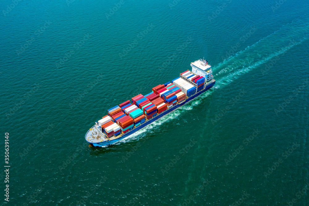 Container , container ship in export and import business and logistics. Shipping cargo to harbor by 