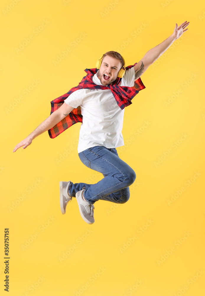 Handsome dancing man on color background