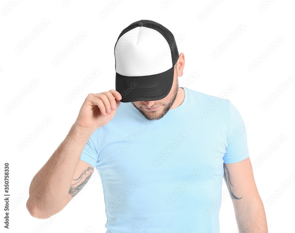 Handsome man in stylish cap on white background