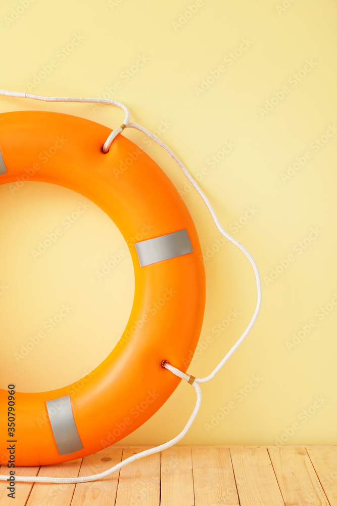 Lifebuoy ring on color background