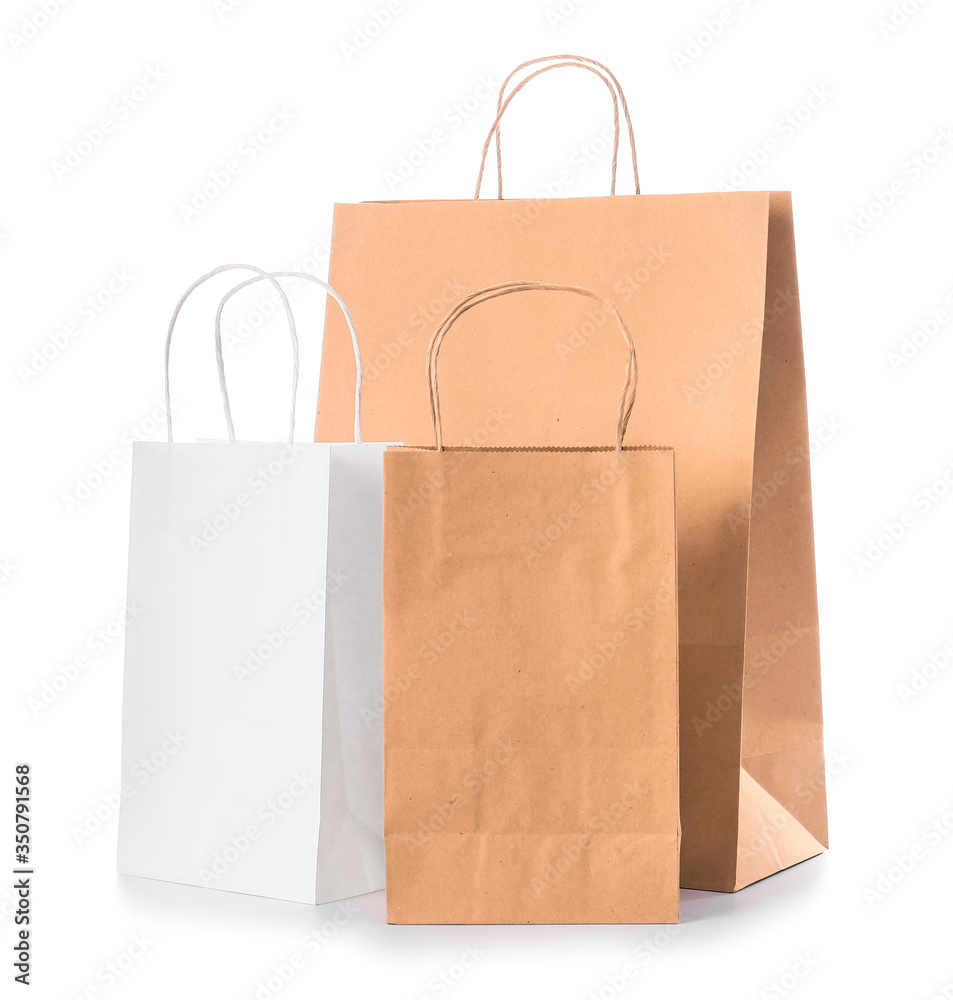 Paper shopping bags on white background