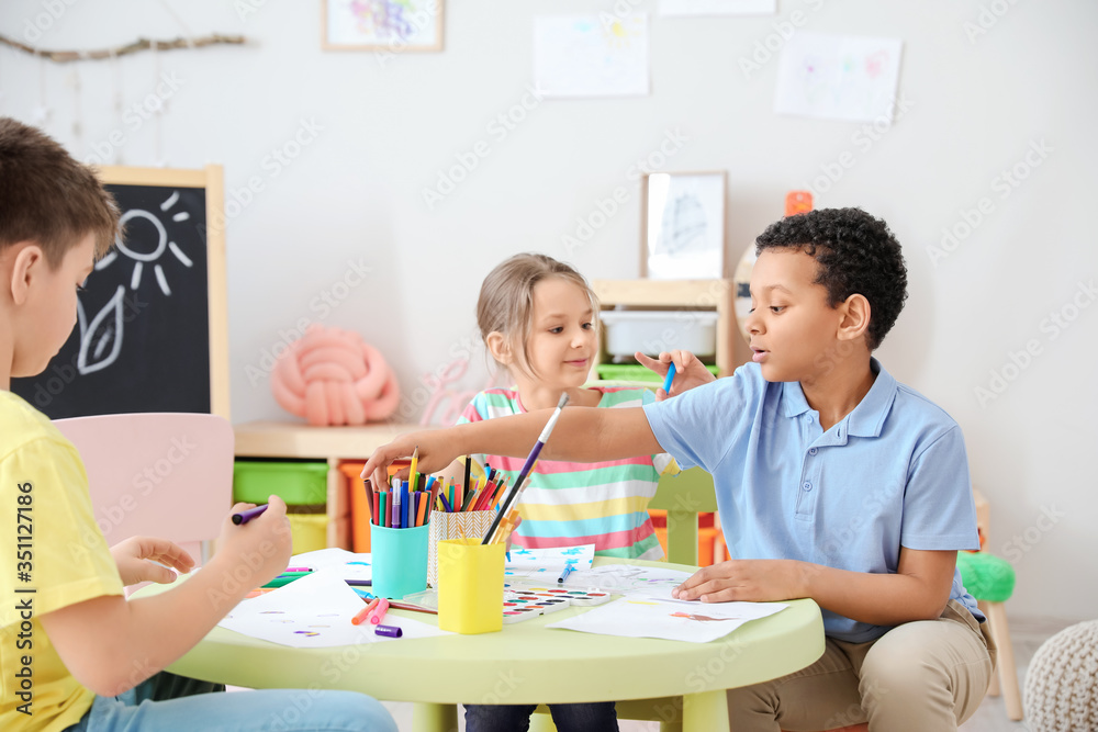 Cute children drawing at school